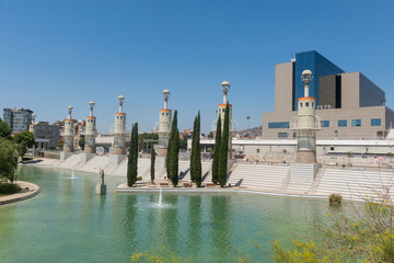Panorama of Parc de l'Espanya Industrial in summer day. In the background, Sants station, the main train station of the city