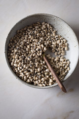 Black eyed peas in a ceramic bowl on top view
