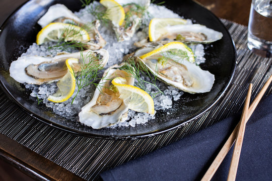 Oysters with citrus on rock salt