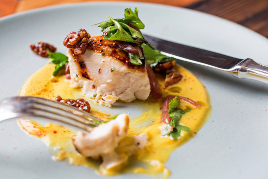 Eaten Grouper dish with yellow sauce