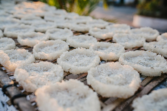 Drying rice cakes in a Buddhist Temple, Luang Prabang, Laos, Indochina, Southeast Asia, Asia