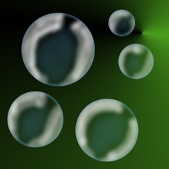 Transparent bubbles on a green background