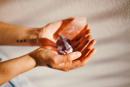 Woman's hands holding crystals