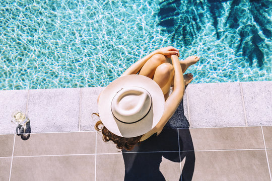Overhead shot of young beautiful redhead woman in bathing suit r