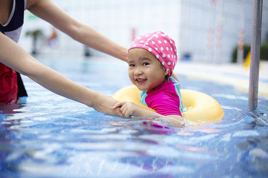 Lovely Little Asian Girl Having Fun In The Swimming Pool