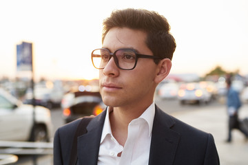 Serious young man outside airport