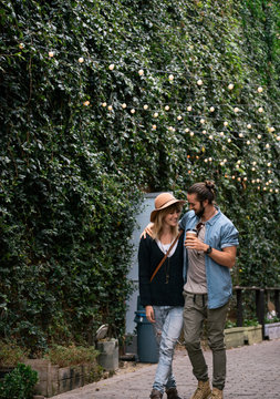 Couple walking together down a paved walkway