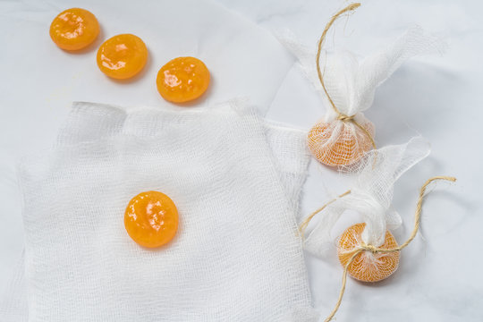 Wrapping Cured Egg Yolks in Cheese Cloth