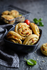 Vegetarian bread rolls filled with sun - dried tomato, green onion and Mozzarella