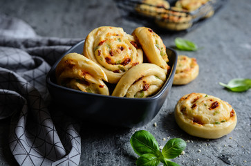 Vegetarian bread rolls filled with sun - dried tomato, green onion and Mozzarella