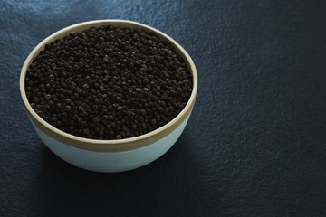 Black peppers in bowl