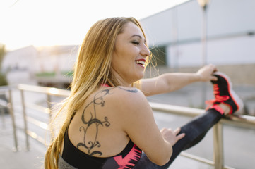 Fit woman stretching after run