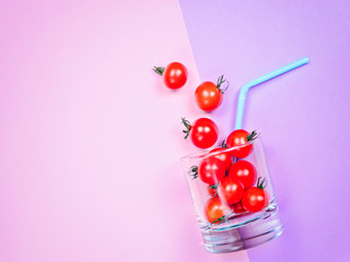 Tomato juice or smoothie, cherry tomato in drink glass with straw