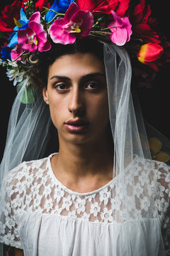 Portrait of teen boy wearing veil and flower crown