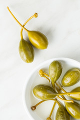 Pickled caper berries.