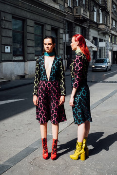 Two Fashion Models Posing on the Street