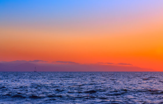sailboat at sunrise