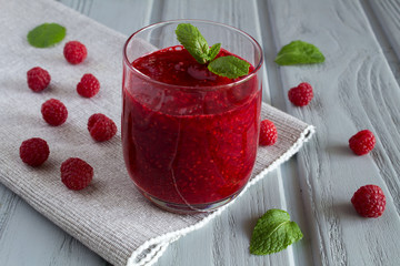 Smoothies with raspberries on the grey napkin