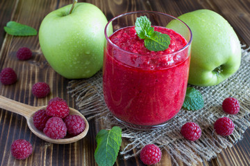 Smoothies with raspberries and apples  on the wooden rustic  background