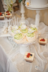 Small table with sweet delicious cakes 8042.