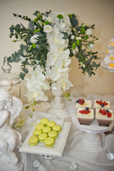 Flowers adorned the table with sweet desserts and cakes 8049.