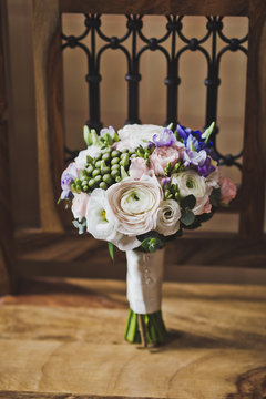 A bouquet of flowers on an old chair 8080.