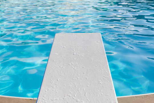 Horizontal view of diving board over a pool