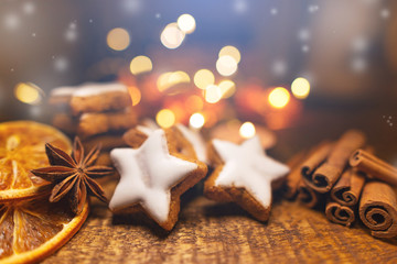 Fototapeta na wymiar Cinnamon Cookies on wooden Background with Glitter and lights Bokeh