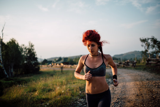 Young attractive woman running outdoor
