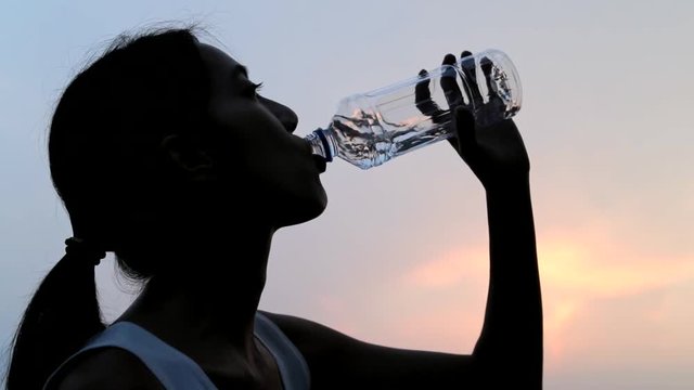 Slow motion of woman drink of water