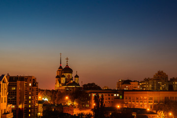 Night city Voronezh, Russia, Annunciation Cathedral among other buildings and houses