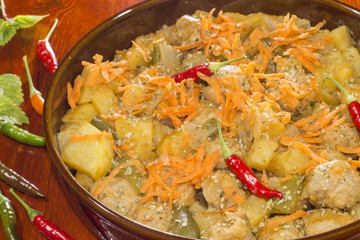 homemade  meatballs with  vegetables, 
seasoned with dried oregano leaves

