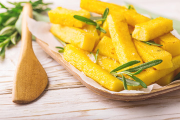 Polenta fries with rosemary. Italian appetizers. Horizontal view.