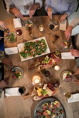 Overhead of friends dining together