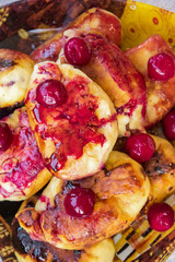 hot pie with berries, fried in oil, lined in a dish, a mug of cold milk, on a napkin