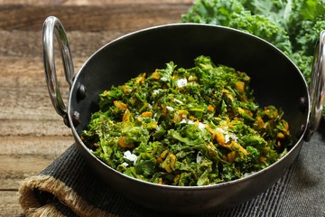 Kale leaves stir fried with Turmeric and coconut, selective focus