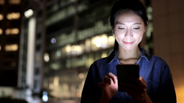 Woman use of smart phone in Hong Kong city