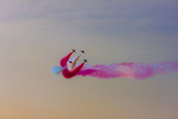 Turkish acrobatic aviation squadron flying over Izmir (Turkey) in the sunset sky. 9th september...