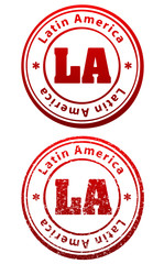 Pair of red rubber stamps in grunge and solid style with caption Latin America and abbreviation LA