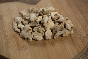 Close up of dried gingers on wooden board