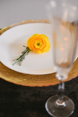 autumn floral bouquet in a pumpkin vase for Halloween. Table setting for wedding