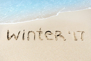 Winter 2017 sign sand near sea ocean tropic beach