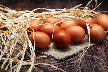 Egg. Fresh farm eggs on a wooden rustic background