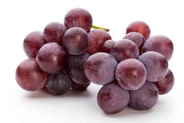 Ripe red grape isolated on white.