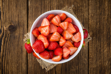Fresh made Sliced Strawberries on a rustic background