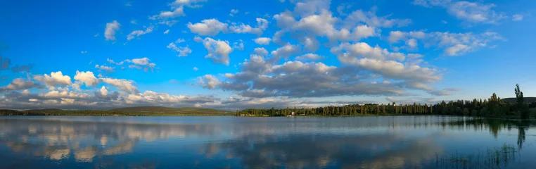 Foto op Canvas natural reflections on a lake and beautiful clouds. © Gennadiy Iotkovskiy