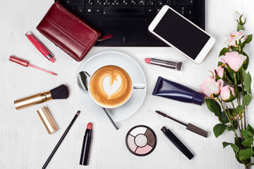 Cosmetics laptop cup of coffee cappuccino purse mobile phone smartphone flowers