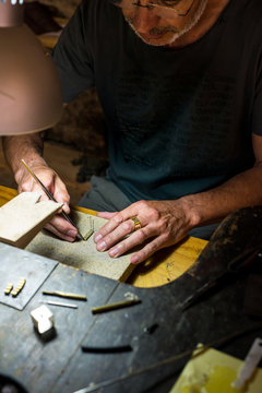 Jeweler making a necklace on his wokshop