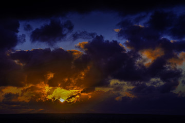 Fototapeta na wymiar Sun rise over the ocean before storm / Lanzarote / Canary Islands 