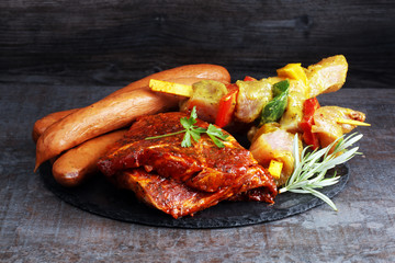 Selection of marinaded meat for bbq grilling with herbs on table